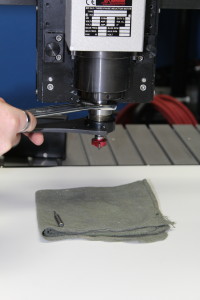 Cloth below router head to catch cutting tool