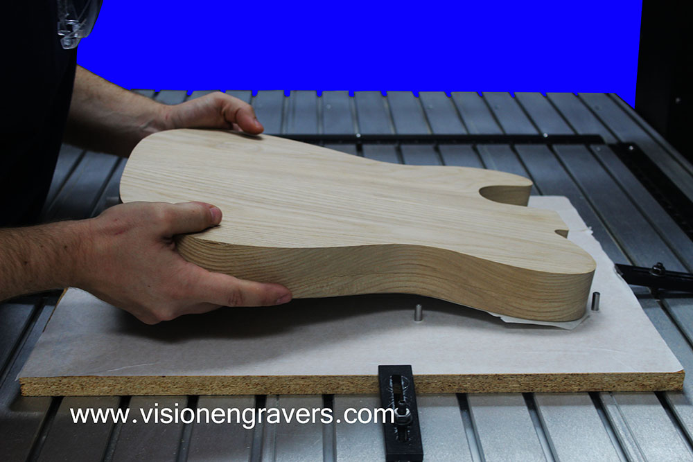 Placing the guitar blank on to the MDF Sacrifical 