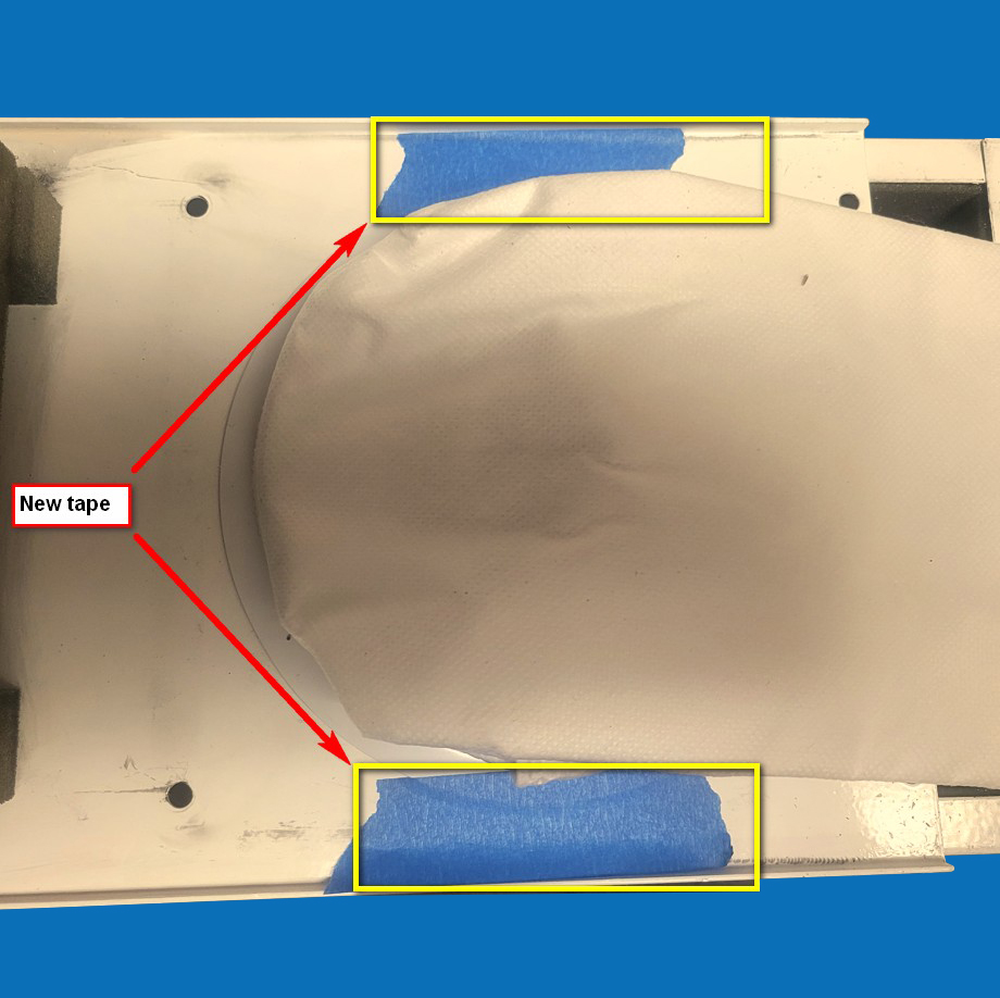 After changing the Vacuum Bag use removable tape to hold the Vacuum Bag in place. Fig5